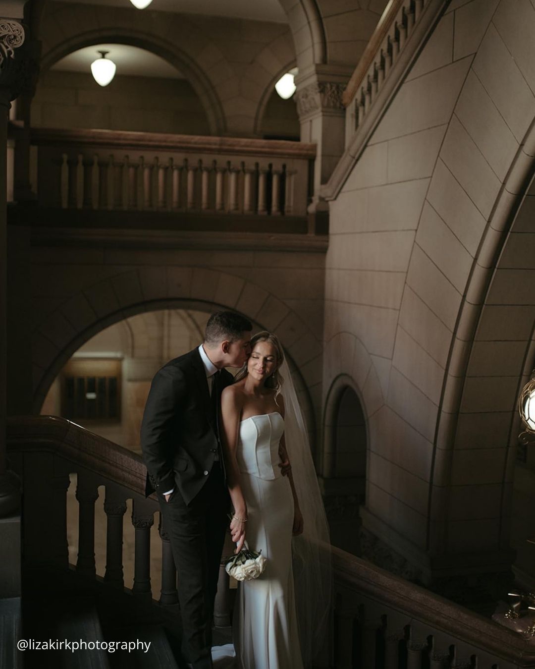 The Groom Kisses Bride's Forehead Tenderly