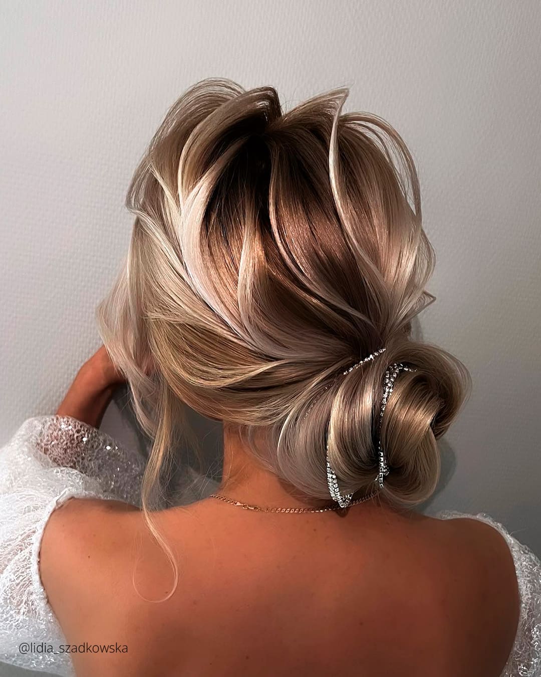 Curly Side Bun Wedding Hairstyle