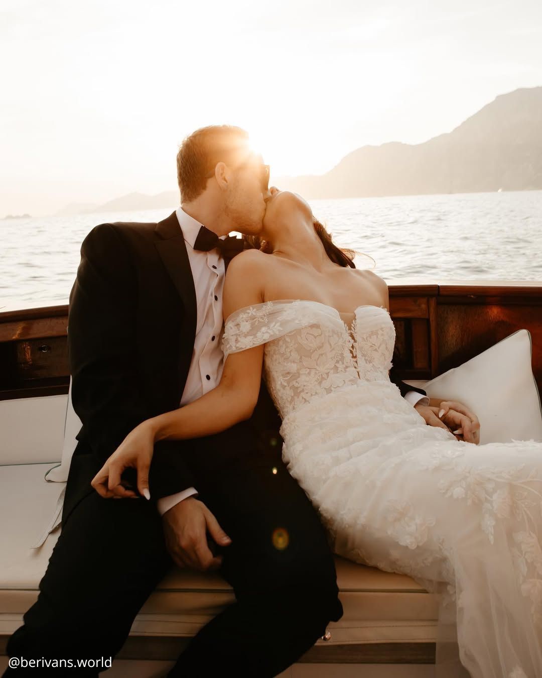 wedding photos passionate kiss of the happy brides on the boat at sunset berivans.world