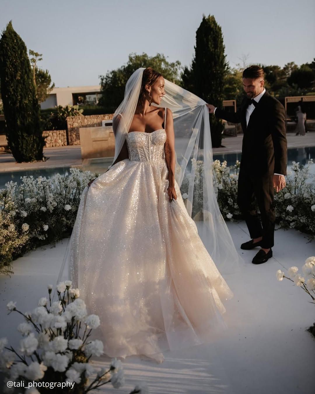 wedding photos first dance traditional of the happy brides he holds her veil tali photography
