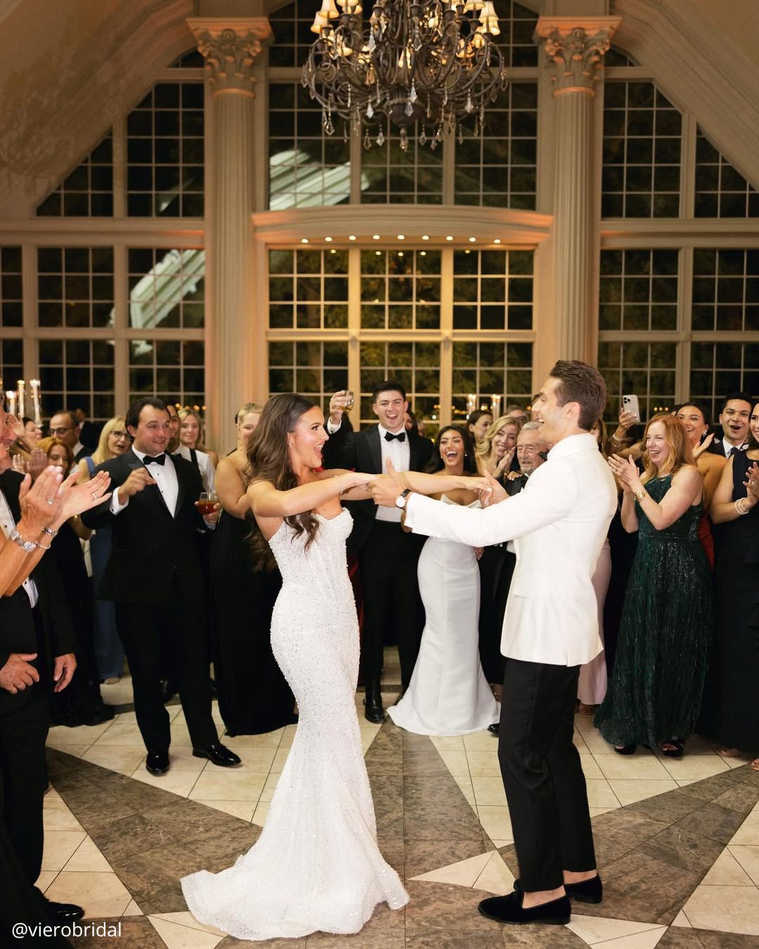 wedding photos happy brides dance the first dance in the evening guests watch vierobridal