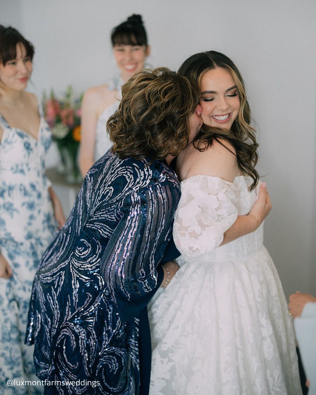 wedding photos family photo mom kissing the bride luxmontfarmsweddings