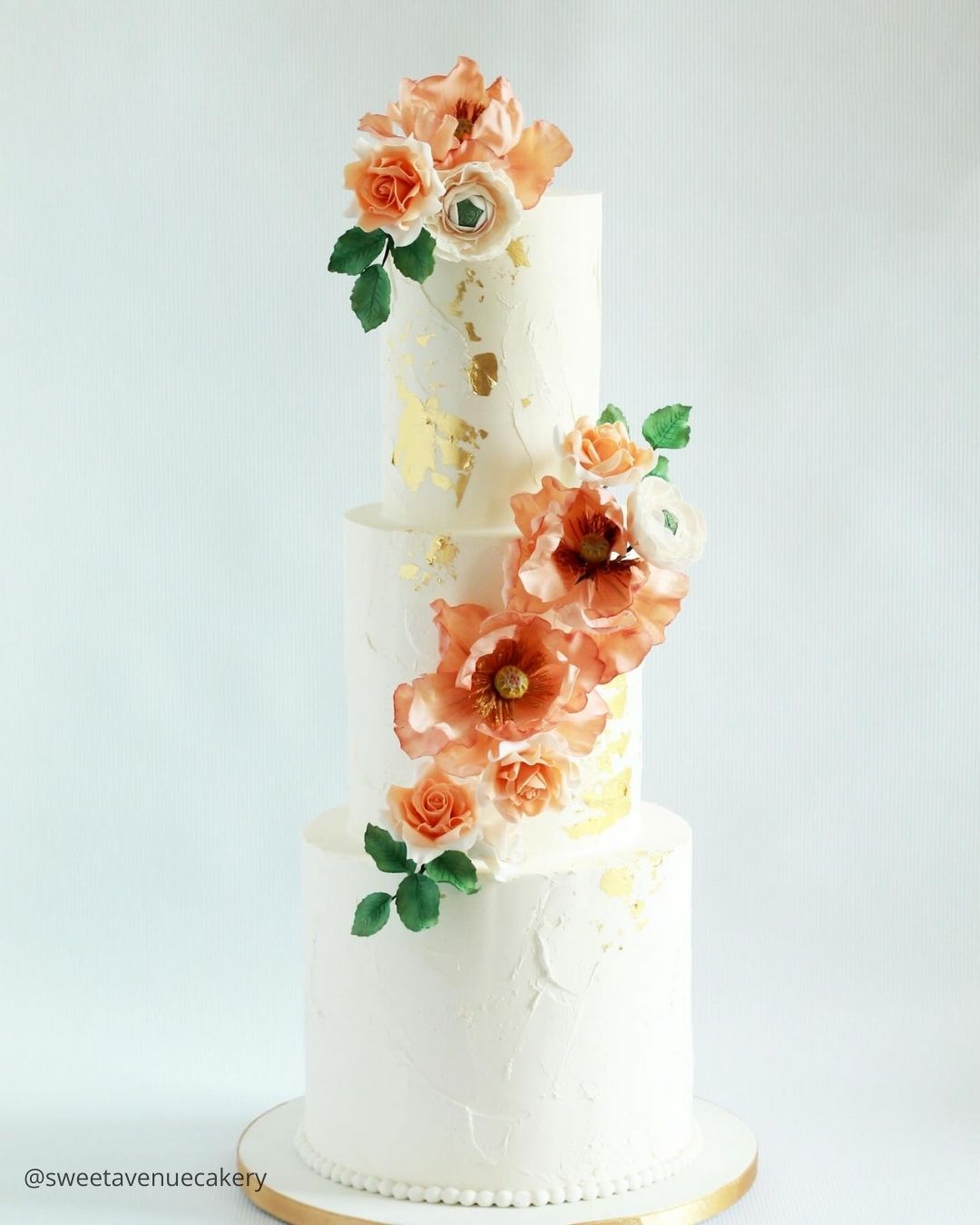 wedding cake trends white three tier wedding cake with cascade of peach sugar roses