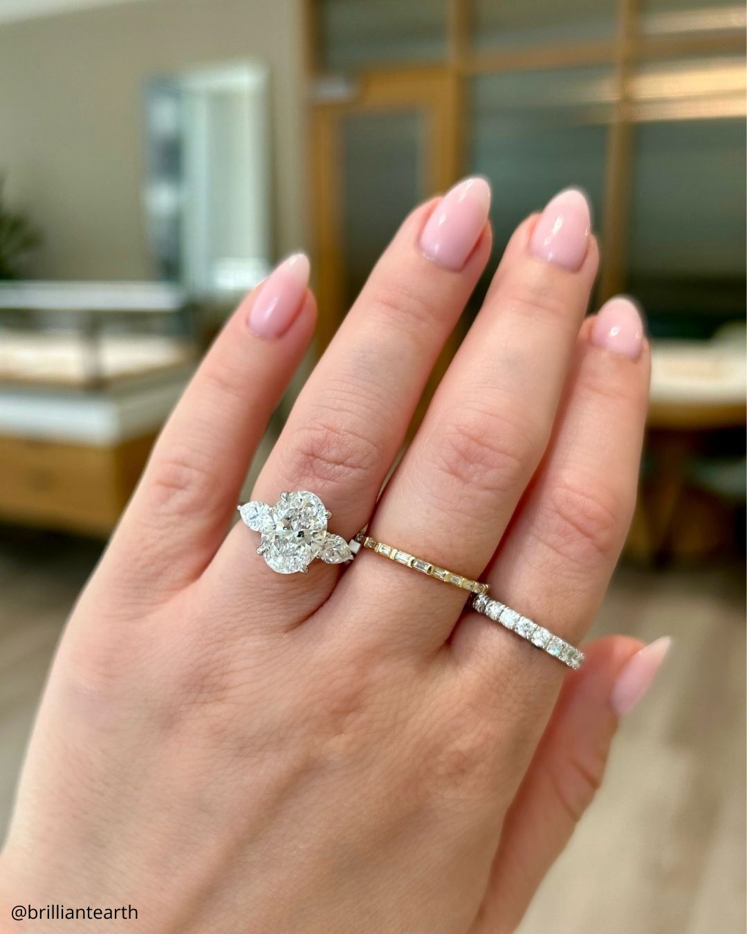 Round Cut Three Stone Rings