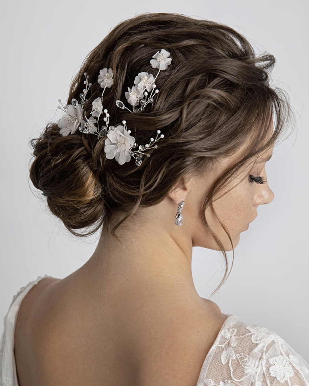 Low Bun With Elegant Headpiece by Ulyana Aster